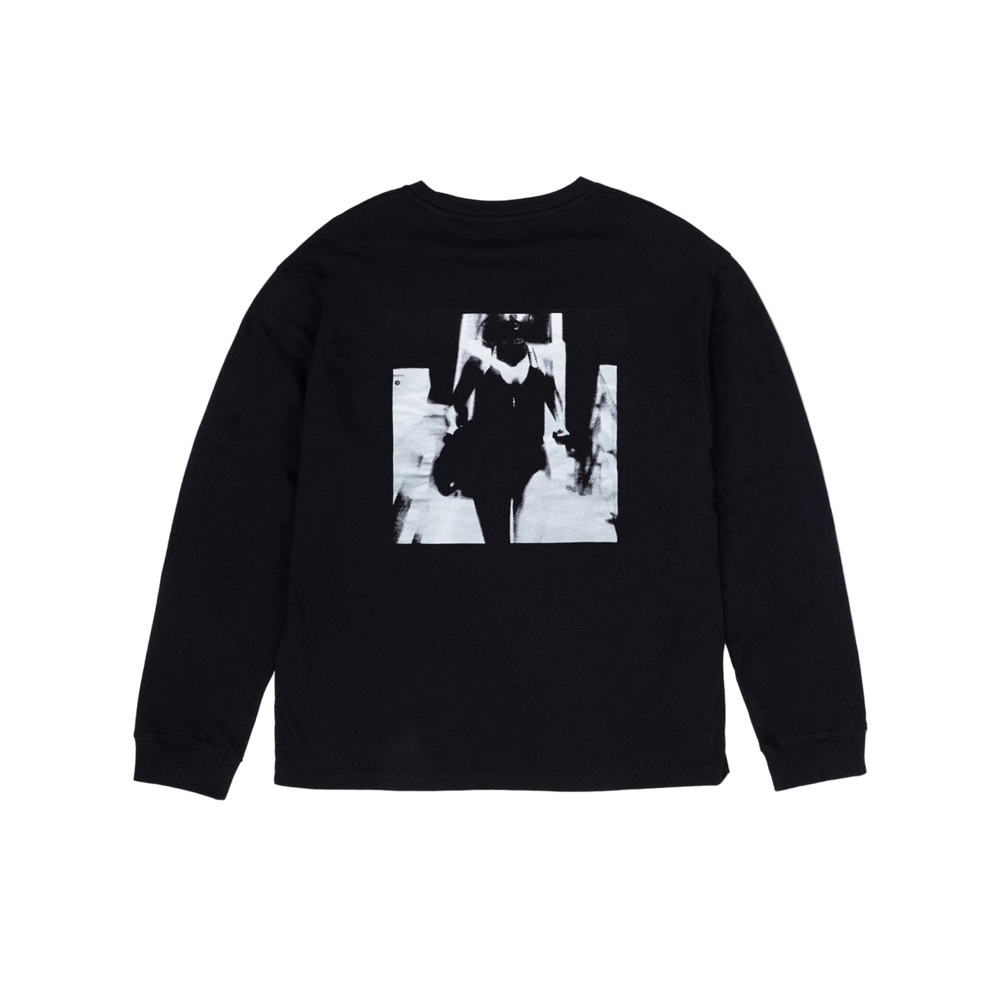 Black long-sleeve shirt with a graphic design on a light gray background