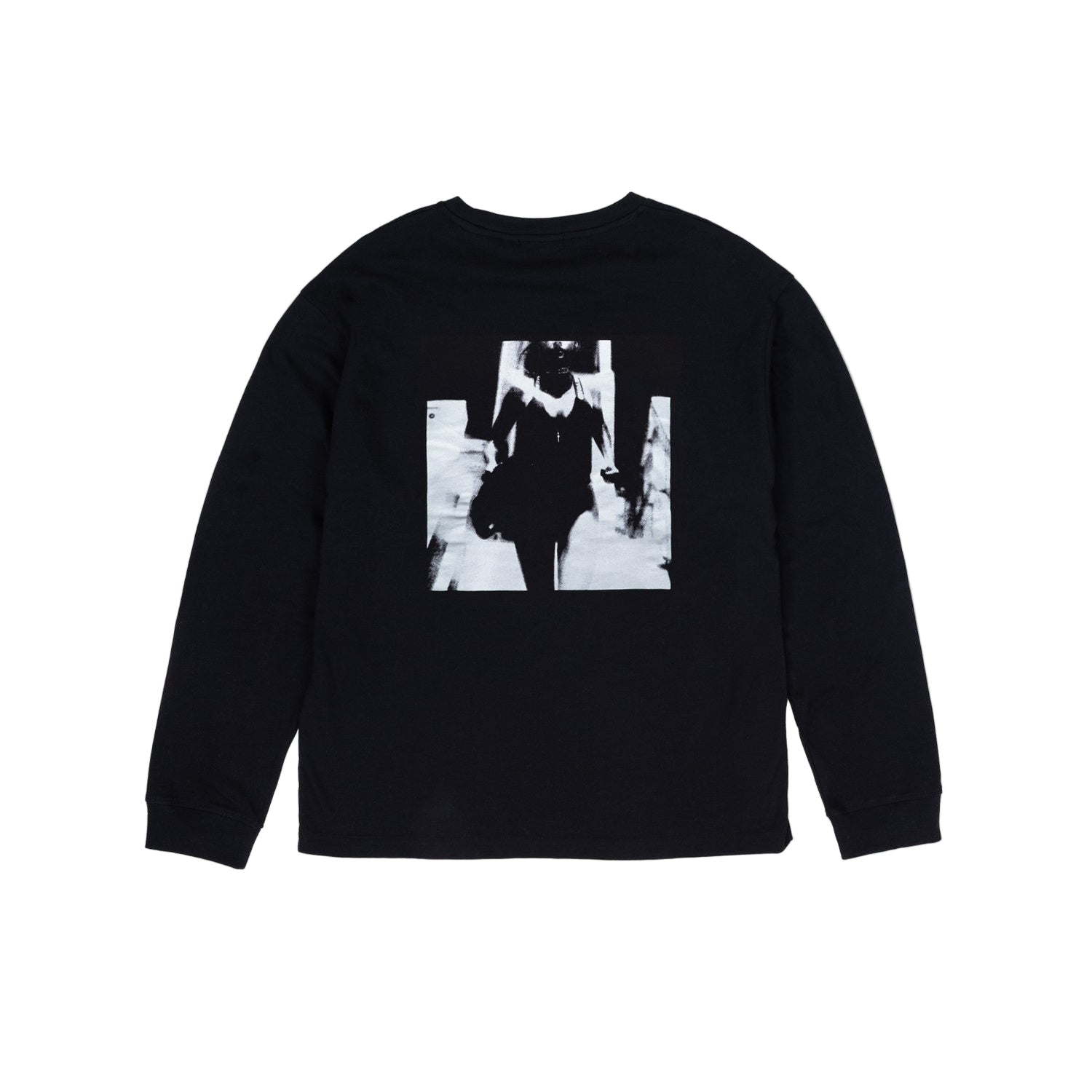 Black long-sleeve shirt with a graphic design on a light gray background