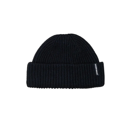Black beanie with a brand logo on a light gray background