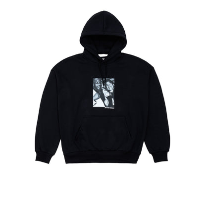 Black hoodie with a graphic design on a light gray background