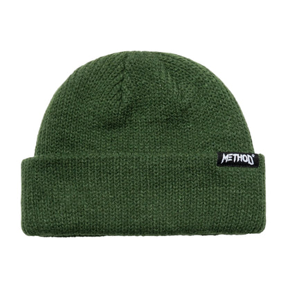 Green beanie with a logo on a white background