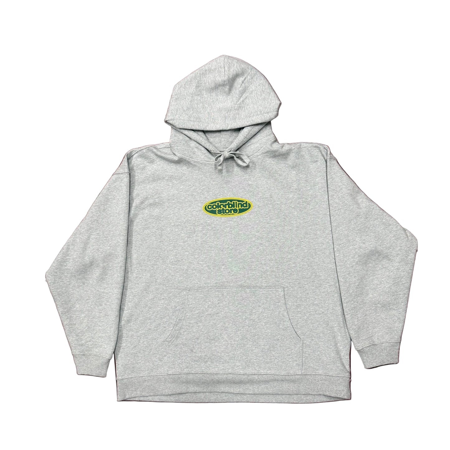 Gray hoodie with a logo on a green patterned background