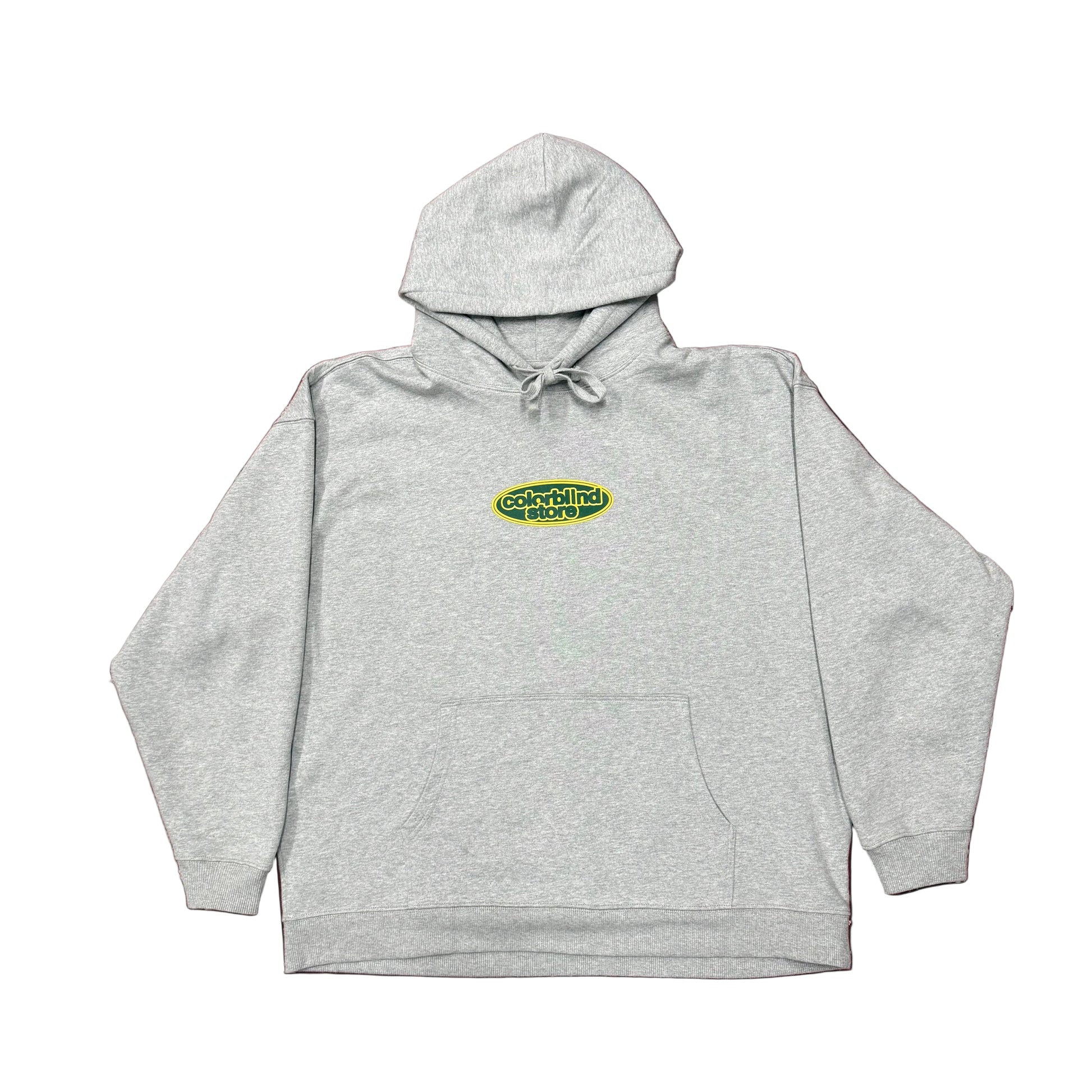 Gray hoodie with a logo on a green patterned background